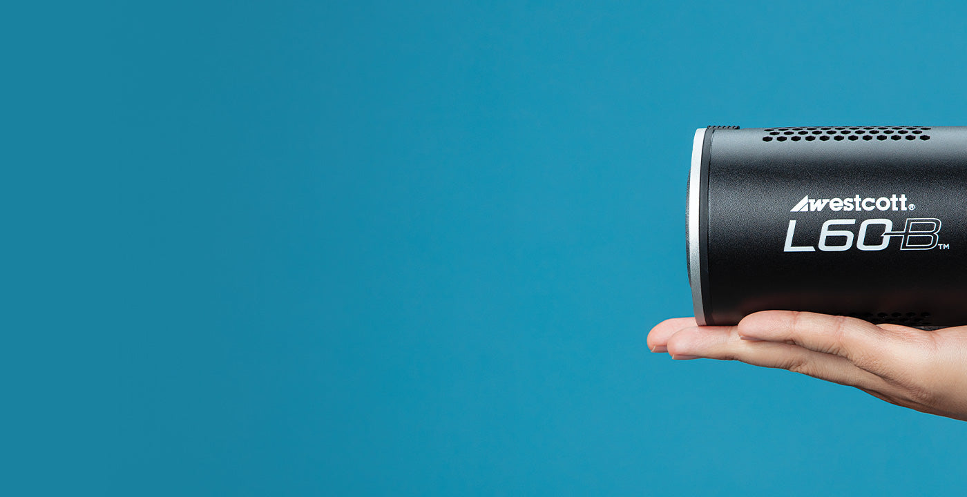 L60-B LED COB Light for Video and Photography being held in one hand