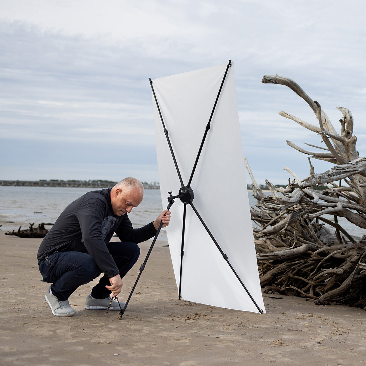 Sal Cincotta setting up the Fusion light control system on a beach using the ground stakes