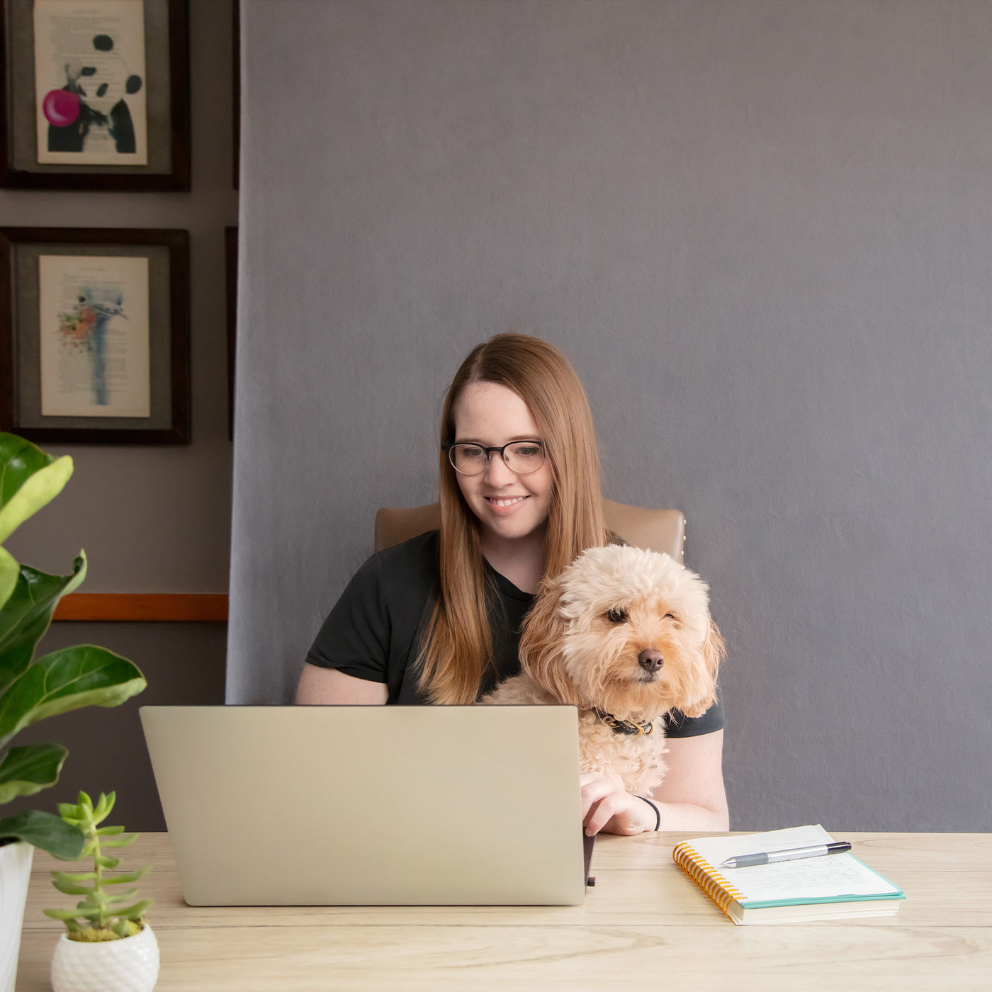 Woman video conferencing with gray backdrop 