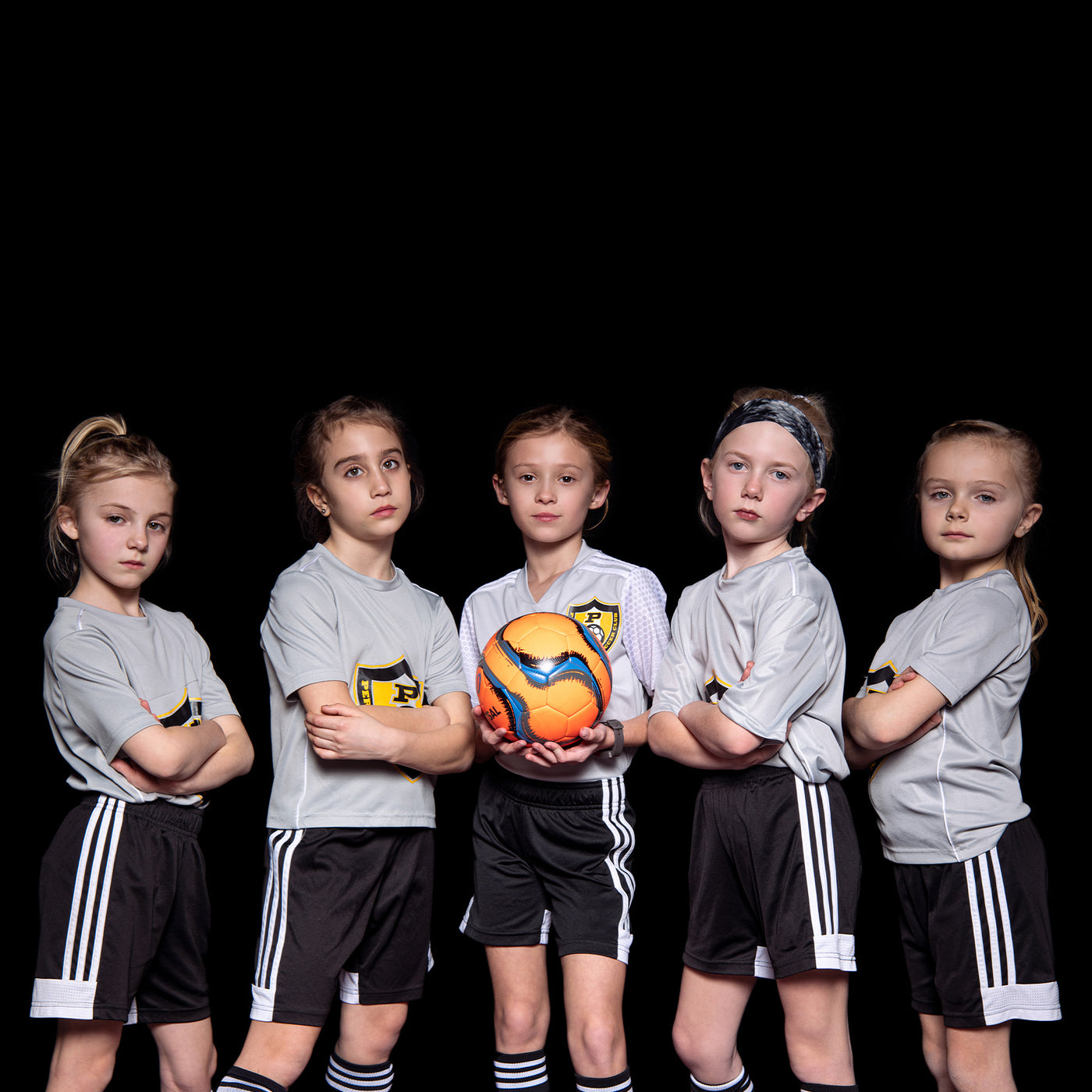 Soccer team portrait shoot using 8' x 8' X-Drop Pro wrinkle-resistant backdrop