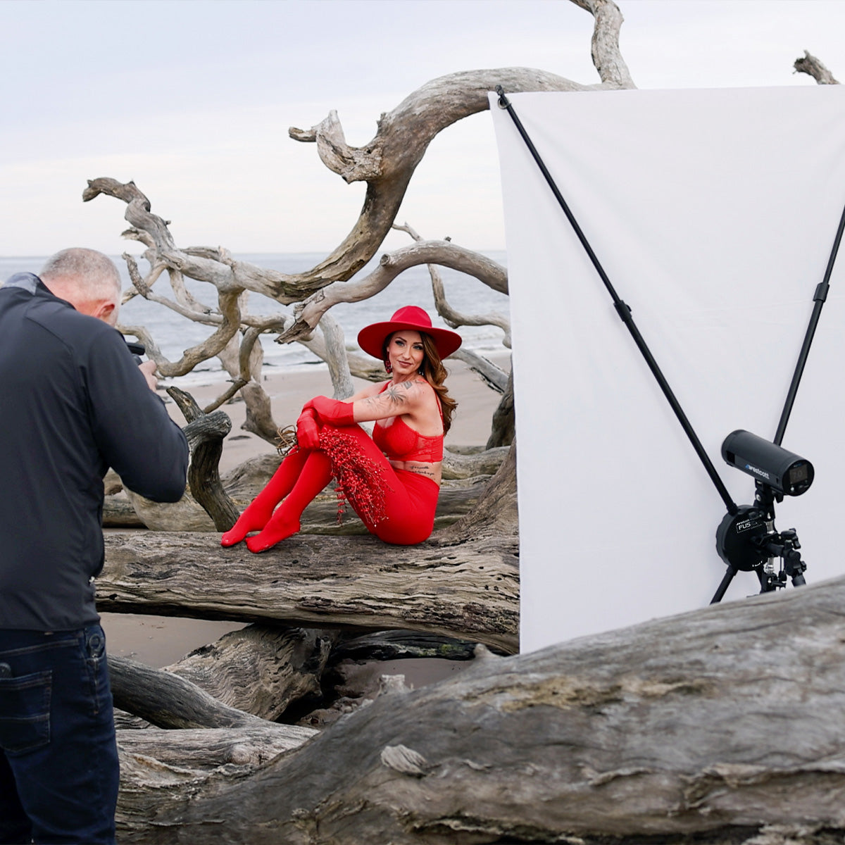 Sal Cincotta photographing a model on the beach using the Fusion light control system