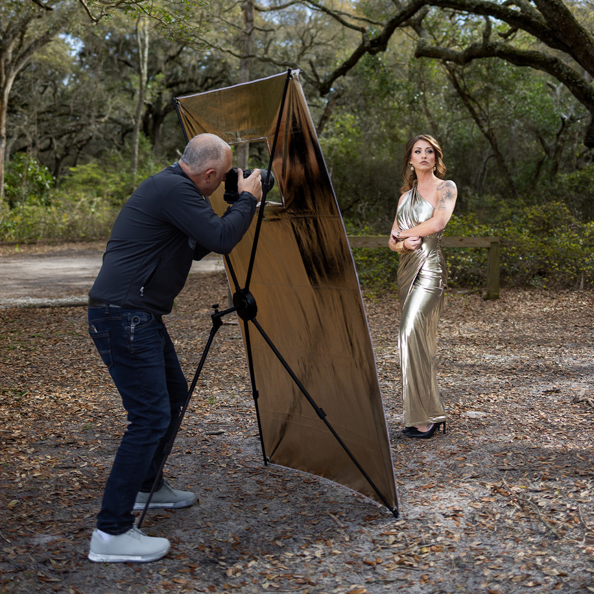 Model being photographed by Sal Cincotta using the Fusion light control system silver shoot-through reflective panel