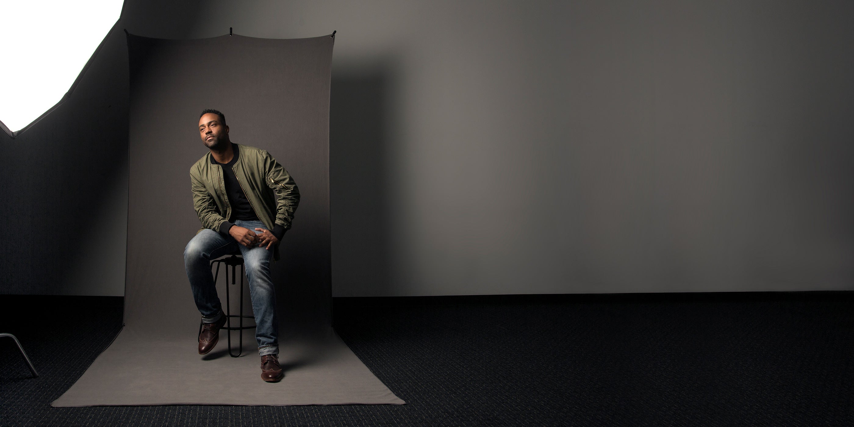 Full-Length Portrait on Chair With 5' x 12' X-Drop Sweep Backdrop