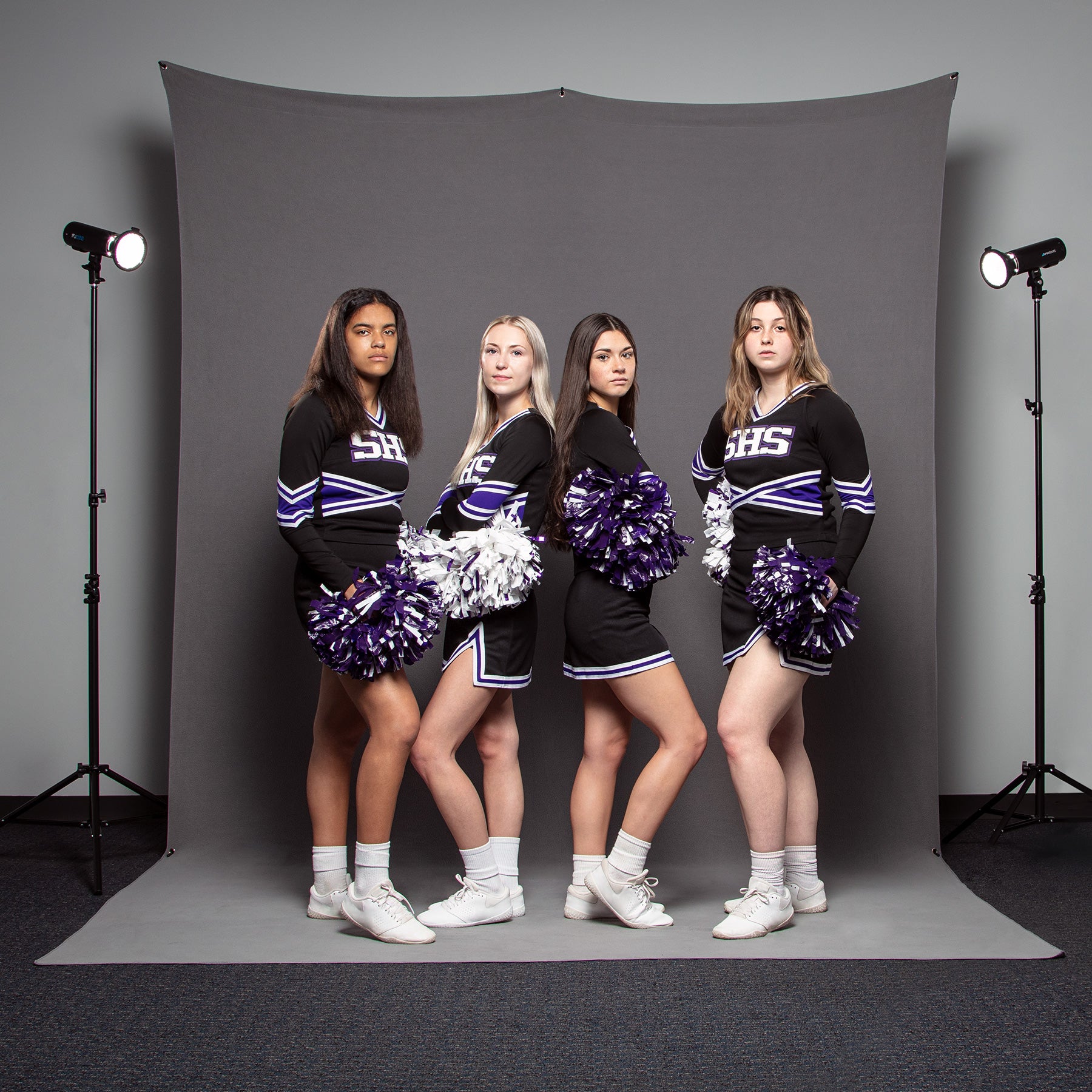 Indoor Cheerleader Group Portrait Using 8' x 13' X-Drop Pro Sweep Backdrop