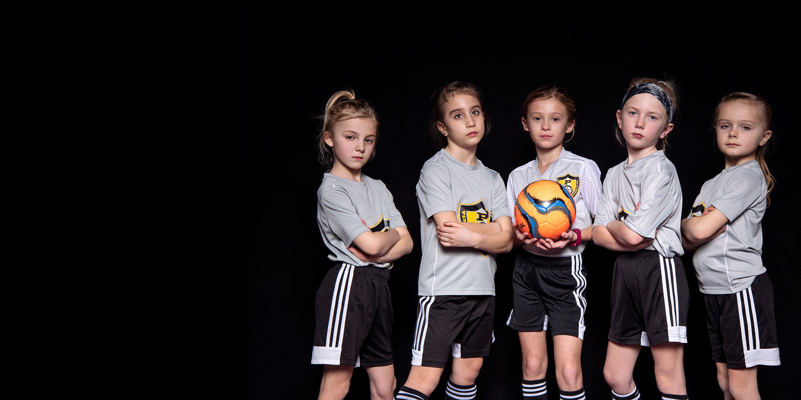 X-Drop Pro Backdrop being used in small group sports team photo