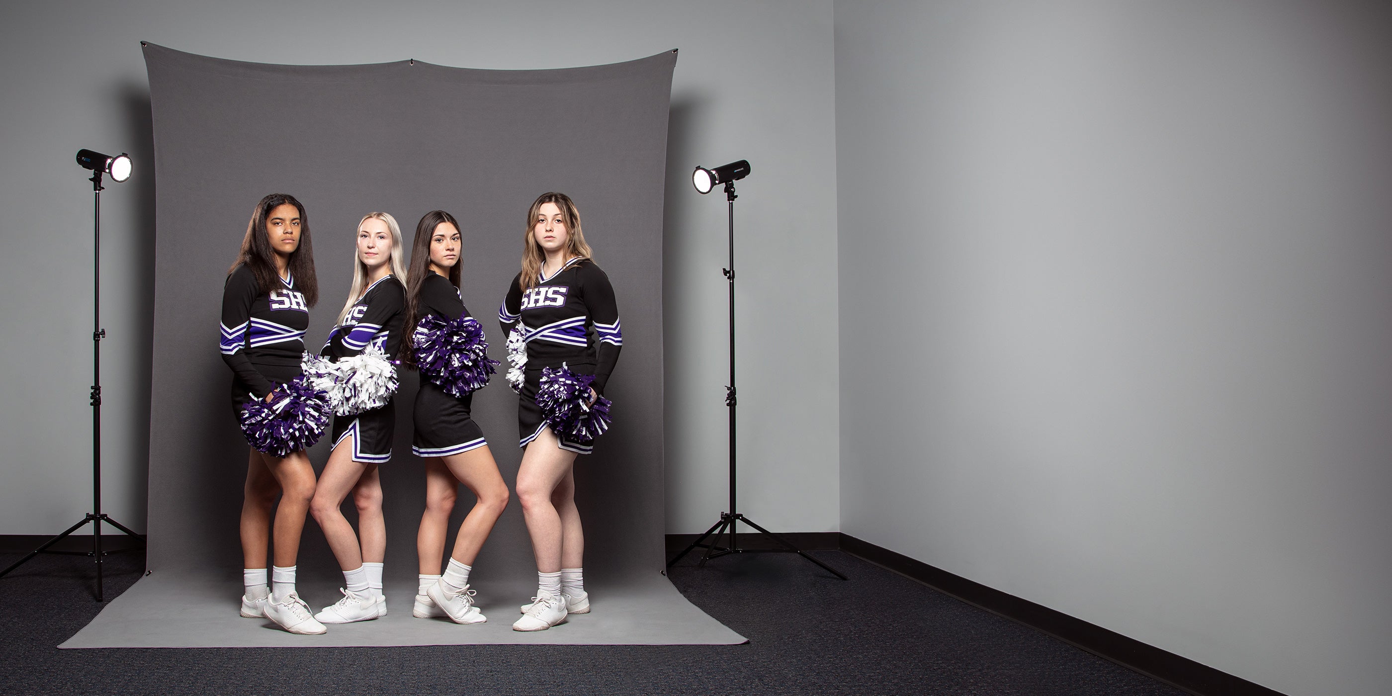 Indoor Cheerleader Group Portrait Using 8' x 13' X-Drop Pro Sweep Backdrop